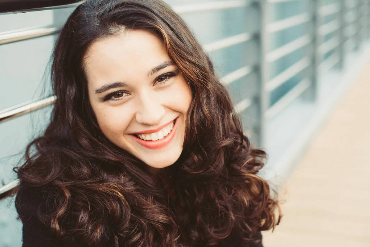 Young girl with white teeth smiling